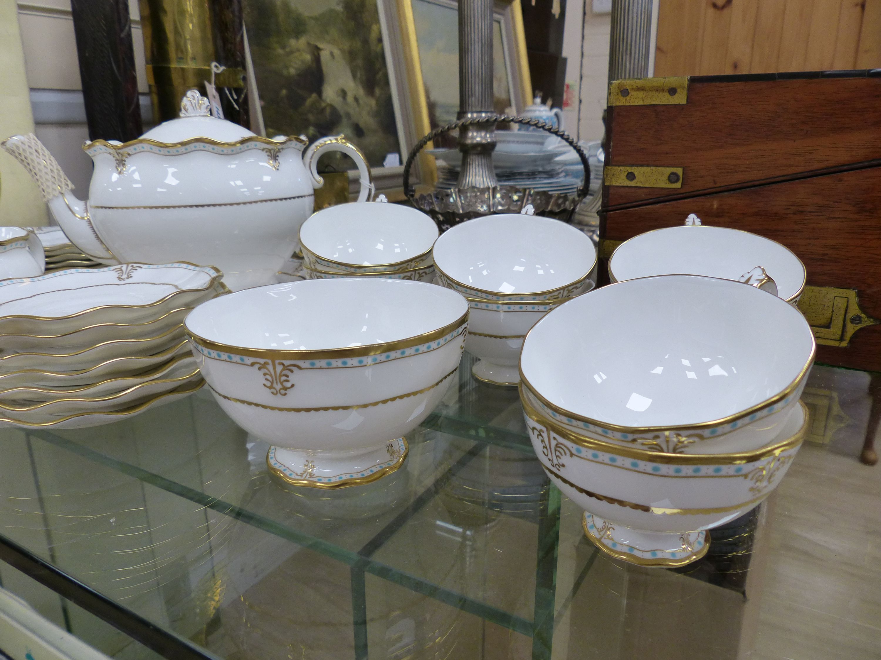 A Royal Crown Derby white bone china tea service with gilt and turquoise decoration, Lombardi pattern